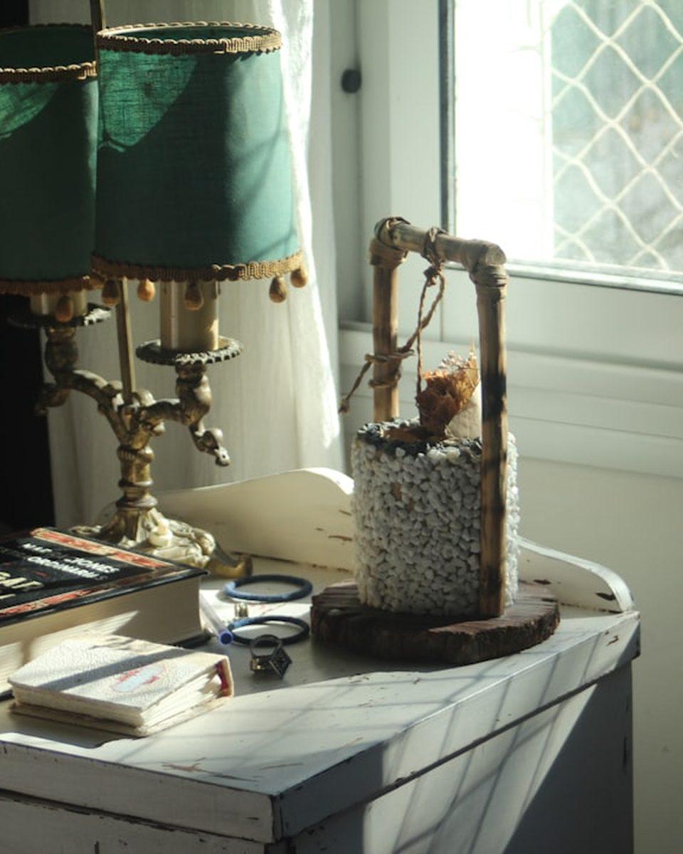 A carafe and a book on the bedside table